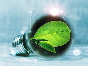 an image of a green leaf in a lightbulb to illustrate a good idea and the article about the benefits of delivering energy efficiency projects like LED and Solar PV cash flow positively.